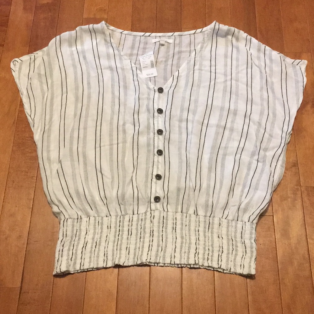 White with black striped V-neck shirt